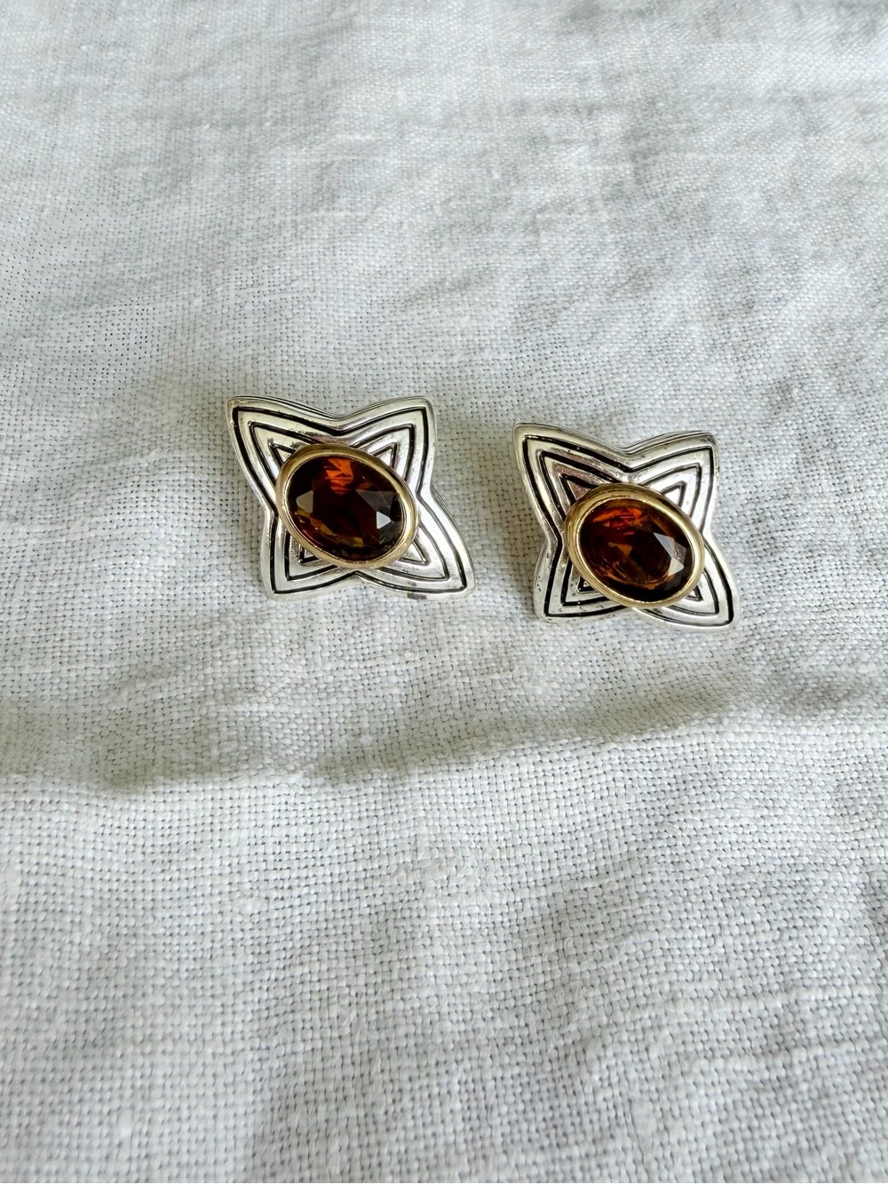 Avon clip on earrings in a unique star shape with faceted brown stones
